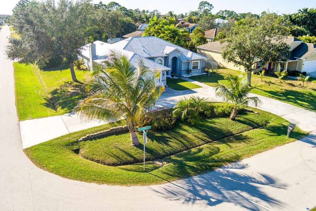 Photo of 1002 SW Hamrock Avenue, Port Saint Lucie, FL 34953 (MLS # R11154886)