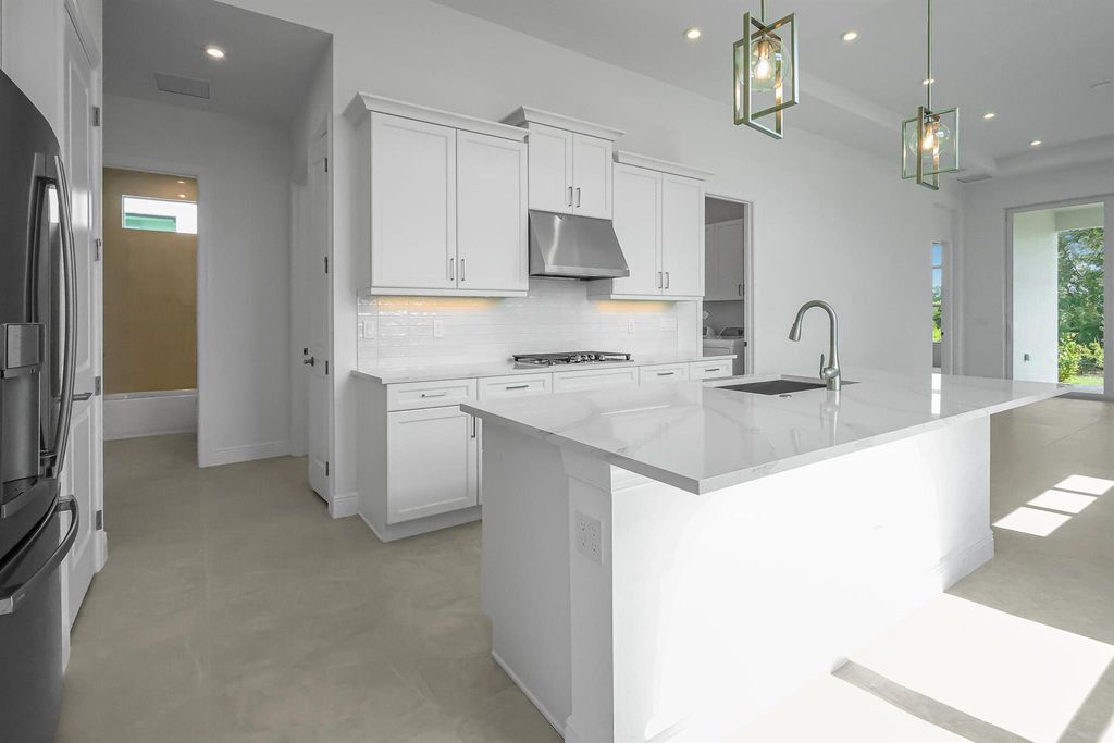 Photo of 399 SE Via Sangro, Port Saint Lucie, FL 34952 (MLS # R11122811)
