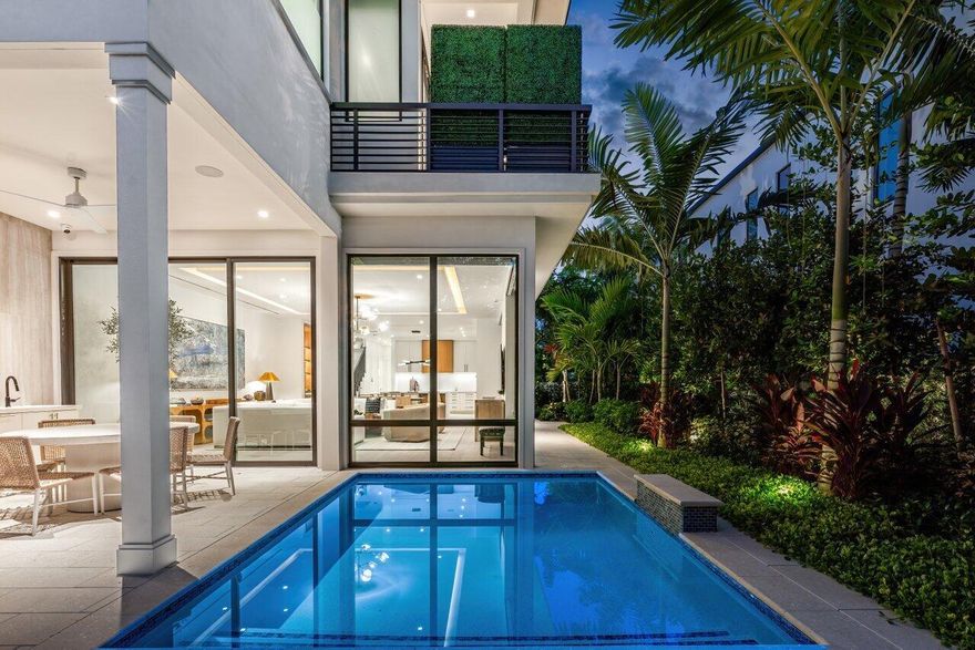 Many of the most renowned architects of the 20th century shared an ambition to connect the interior of a home to nature just outside its walls, developing a beloved style of organic design that has persisted for decades, but has never been easy to recreate. This natural, flowing aesthetic is alive and well at 512 NE 7th Avenue in Delray Beach's Palm Trail neighborhood, a home where exquisite modern interiors blend seamlessly with the environment surrounding them to create a coastal haven. Comprising 3,853 total square feet, 3,001 of which are under air, this residence includes 4 bedrooms and 3.1 bathrooms along with an additional space that can be either a home office or den. Upon entering through the front door, visitors are greeted by an unmistakable interior design
