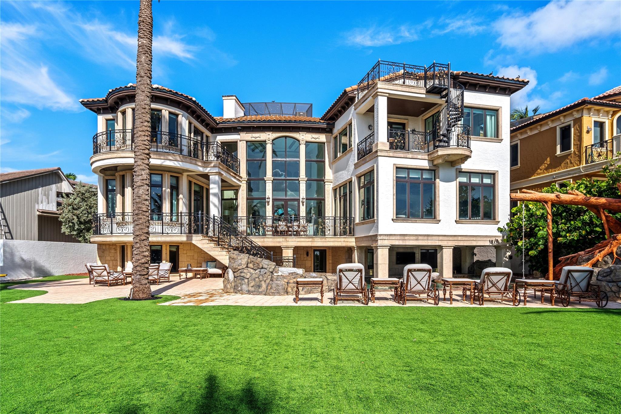 Rare Oceanfront Estate On Hillsboro Point! Located in the sought-after enclave of Hillsboro Shores, this exquisite estate is a masterwork of design, where nearly every principal room opens to a terrace or balcony framing sweeping sunrise views of the Atlantic Ocean, the Hillsboro Inlet and the iconic Hillsboro Lighthouse. Sited on over half an acre, enjoy three levels of luxury living including oversized primary suite, custom chef’s kitchen, & decorative detailing throughout. Features include elevator, 4-bay garage, theatre, custom wood paneled office, gym, impact windows/doors, Lutron lighting, putting green, observation deck and more. Outdoor entertainment is enjoyed at the verdant lawn and the resort style pool with swim up bar, tree house slide and spill over spa. Private Beach Access.