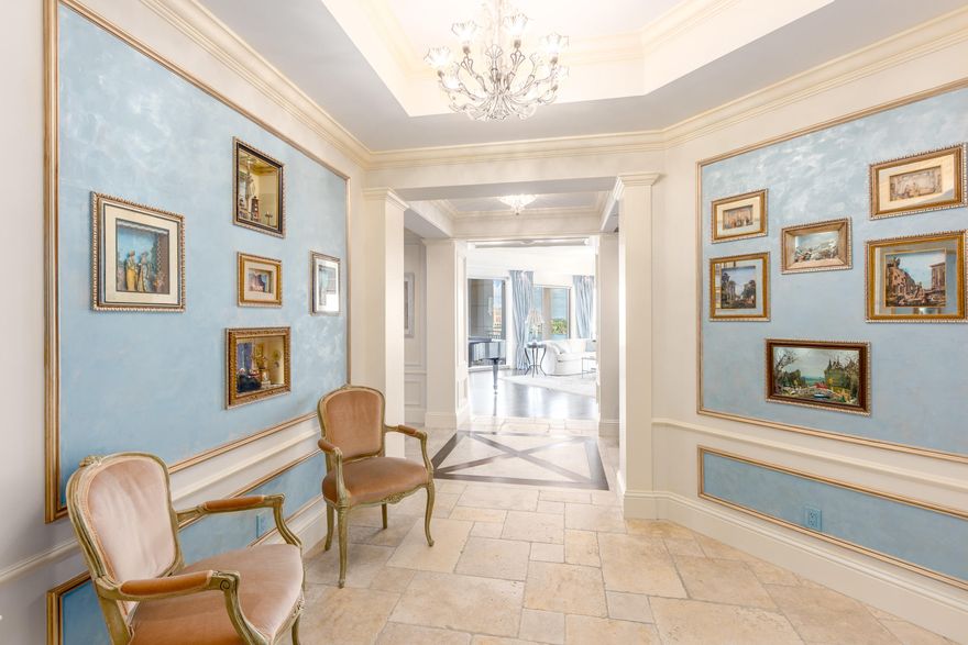 Rarely available and beautiful SE corner (most desirable line) in luxurious condo with far reaching intracoastal views in every direction from every room! Stunning custom details in this 4 BR include hardwood floors, moldings, gourmet kitchen, family room, study, well scaled rooms and sunny balconies, 2 garage spaces and storage. Lives like a sprawling home without responsibilities. Full service white glove building