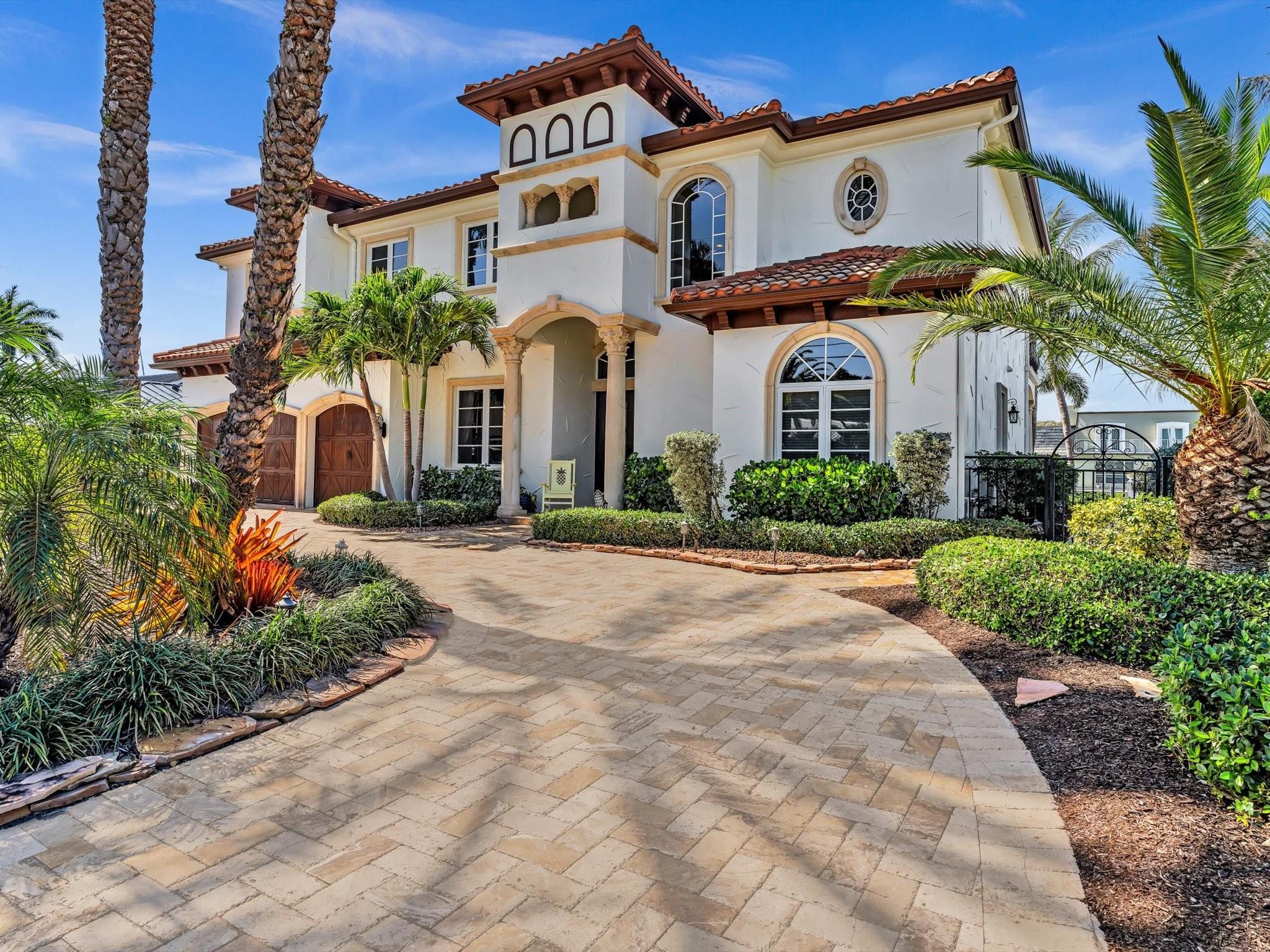Own a piece of paradise in the sought after Lighthouse Point! Seller Financing & Excellent Rate available for qualified buyer. Contact agent for more details. Welcome to this custom waterfront estate with over 90' of dockage, deep canal, and no fixed bridges. This boater's paradise home is located just a few minutes to Hillsboro or Boca Inlets. The home features beautiful architectural details, 7 bedrooms, 4.1 baths, 2 laundry rooms, a walk in pantry, and plenty of linen closets. The home features all Wi-Fi controlled security cameras, A/C, and sprinkler system. The large primary suite has 2 large walk-in closets, and access to a large patio, where you can sit back and relax watching the beautiful Florida sunset. The driveway and pool deck have beautiful travertine pavers.