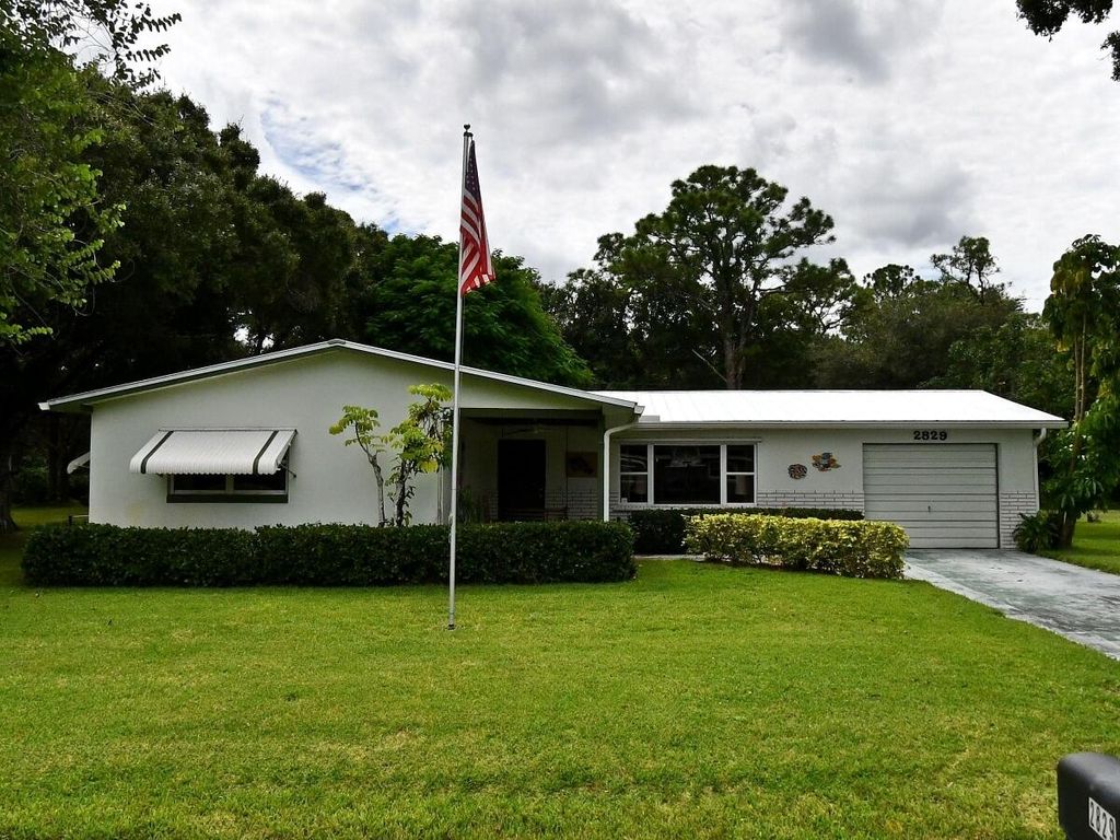 Photo of 2829 Rainbow Drive, Fort Pierce, FL 34981 (MLS # B26004985)
