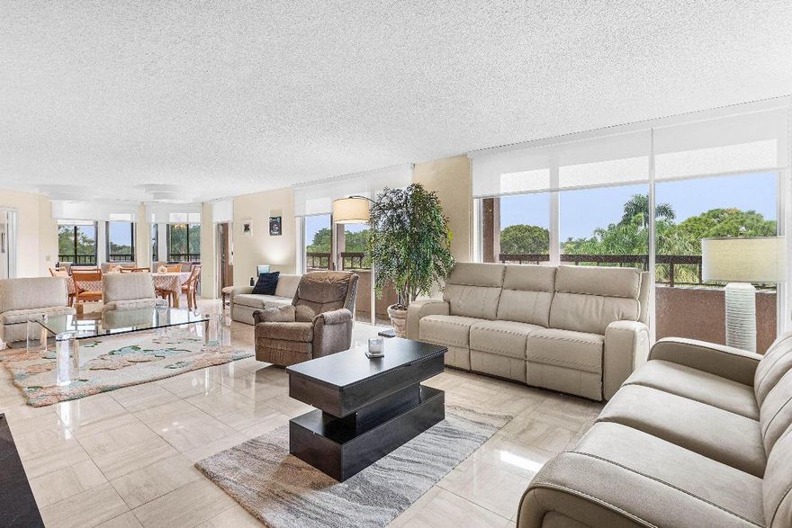 Make this spacious 2-bedroom corner condo your own in the heart of The Fountains Country Club. This light-filled residence overlooks the community pool and features a generous eat-in kitchen and a large private balcony, storage closet/hobby room, an abundance of storage, offering flexibility rarely found at this price point.  This unit presents a fantastic chance to customize and add value in a highly desirable community. Residents enjoy the peace of mind of a manned gate and roving security patrol, along with a on-site pool. entertainment, fine dining, shopping, beaches, and major roadways are all just minutes away. Brand-new roof installed in 2025, Freshly Painted 2026.  An excellent opportunity for buyers looking to renovate and create their ideal Florida retreat or investment.