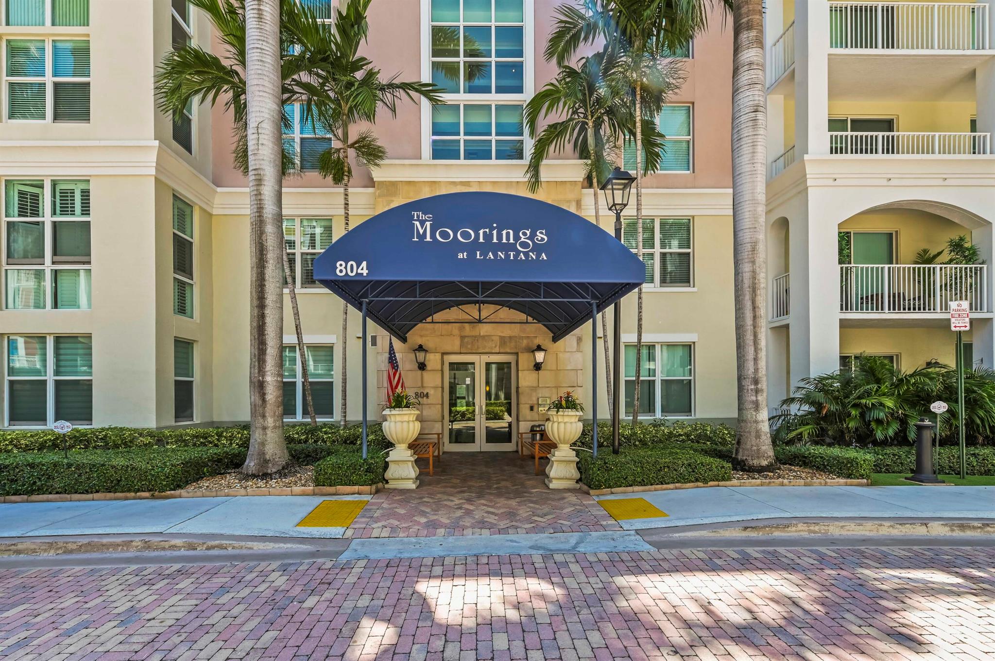 Discover your perfect retreat in this stunning first-floor, garden-view condominium, offering a unique blend of elegance and convenience. Step inside to an inviting open floor plan, enhanced by impressive high ceilings that create an immediate sense of spaciousness and light. The unit's prime location provides easy access to both the building entry and the garage. You'll enjoy modern comfort with a newer air conditioner and the convenience of an in-unit washer and dryer, making daily living effortless. 30 day minimum rentals allows a great income opportunity!