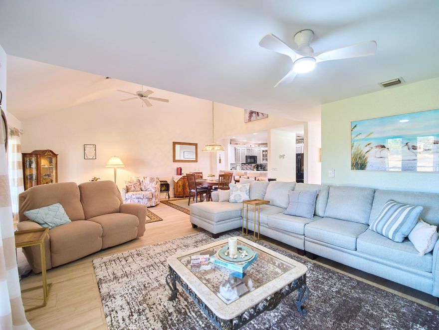 This Beautiful townhouse offers exceptional style and comfort throughout. Featuring two spacious bedrooms plus a large loft area, this home also includes a detached one-car garage. Relax on the screened porch overlooking the 7th hole of Heritage Ridge Golf Course, or unwind in your private front courtyard patio -- the perfect spot for grilling and outdoor entertaining. The open kitchen showcases custom solid wood cabinetry with black appliances. Additional upgrades include a brand new roof, 2023 AC, refinished patio and garage floor, updated master bathroom, dual-tank water softener system, alarm system, plus much more. Beautiful plantation shutters, upgraded lighting fixtures, and ceiling fans enhance every room. The first floor features laminate flooring throughout the main living areas. Berber-style carpeting in the bedrooms, and a stunning custom-built cabinet in the living room. Upstairs, the upgraded bathroom includes a large soaking tub, an expanded separate shower, with custom tile work, and updated vanities with granite counters. The versatile loft area offers a built-in full-size Murphy bed with desk, providing ample guest space and an ideal home office setup.
Georgetown offers low HOA dues that include basic cable and exterior maintenance, including roof replacement. Residents enjoy access to the Georgetown clubhouse and heated pool. The Heritage Ridge Master Association provides additional amenities, including another heated pool, hot tub, tennis courts, and pickleball courts. Golf memberships are available but not mandatory.