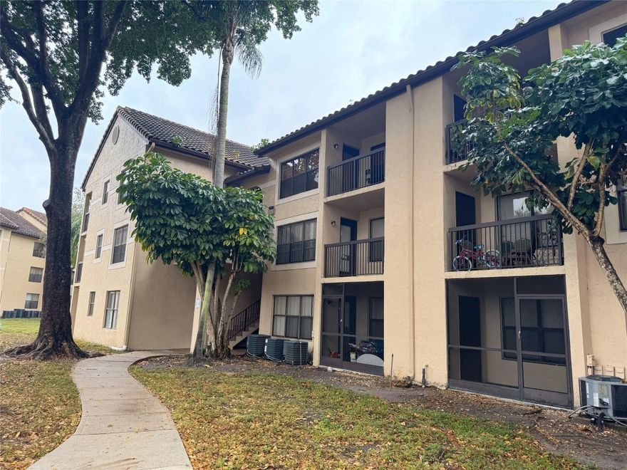 Located in a desirable gated community in the heart of Pompano Beach, this spacious 1-bedroom, 1-bath residence offers an excellent investment opportunity with the ability to rent from day one. The unit features tile and wood flooring throughout, is situated on the second floor, and is part of a well-maintained community offering a wide array of amenities.