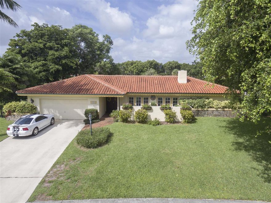 Centrally located in Delray Beach, within a NO HOA neighborhood, sitting on a corner lot which is over 1/3 of an acre and backing up to the golf course, is this your new home! This house is solidly built, with a newer roof, and a new AC unit. Many of the windows and doors have been upgraded to hurricane impact glass. The property layout is perfect for entertaining. It features an oversized pool, covered patio, cabana bathroom, ENORMOUS fenced-in backyard, and mature trees that provide beauty, shade and privacy. Most rooms offer long views of the golf course and lake. The private master suite offers tranquility, since it is set apart from the 3 stacked guest rooms and 2 full bathrooms. Perfect for a growing family; this amazing opportunity will not last long. Call for a private showing!