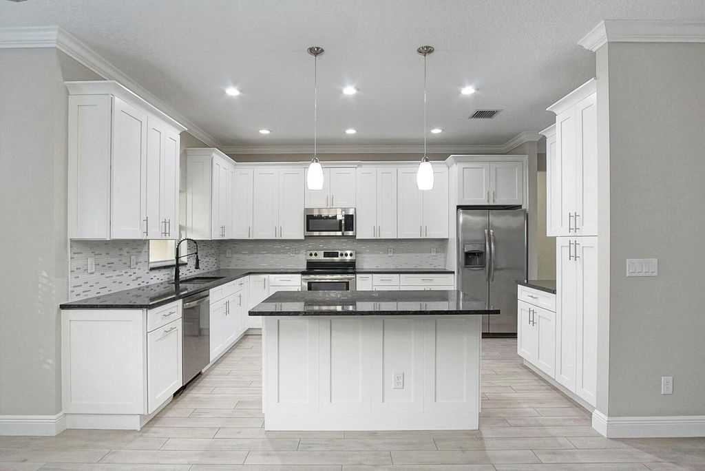 Photo of 2482 SW Valnera Street, Port Saint Lucie, FL 34953 (MLS # R10957950)