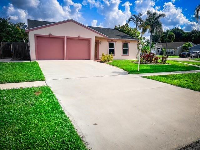 LARGE CORNER LOT 3/2/2 with private in-ground pool and tropical Tiki hut. COMPLETE IMPACT WINDOWS, hurricane rated garage door and fresh paint. Open floor plan split bedrooms and plenty of parking. Interior features: Stainless Whirlpool matching appliances in kitchen with upgraded cabinets, 20" porcelain tile and granite countertops. All plumbing throughout the home was upgraded along with the addition of crown molding. The electric was also updated with the addition of a 30amp generator hook-up for storm season. Roof replaced in 2005 with 50 year composite shingles. Primary bedroom and bathroom was remodeled in 2023 and includes a large walk in closet. SELLER CONTRIBUTING $7500 TOWARD BUYERS CLOSING COSTS!! New flooring in guest bedroom.