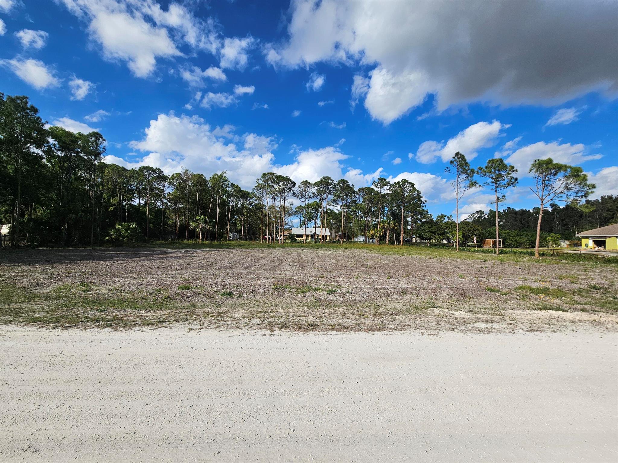 This is a prime 1.15 acre lot in the perfect location to build your custom dream home. This property is located just 4 lots away from Seminole Pratt Whitney, and has just been fully cleared, saving you time, money and peace of mind. Zoned Agricultural Residential with no HOA, allowing for you to bring your boats, trailers, RVs, horses, chickens, etc. Located close to Westlake . Lots of new construction and infrastructure improvements taking place in the surrounding area adding value to the land. Preliminary Soil Test and Survey available upon request.