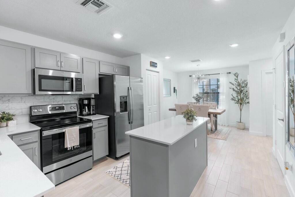 Photo of 5031 Genove Place, Riviera Beach, FL 33410 (MLS # R10995682)