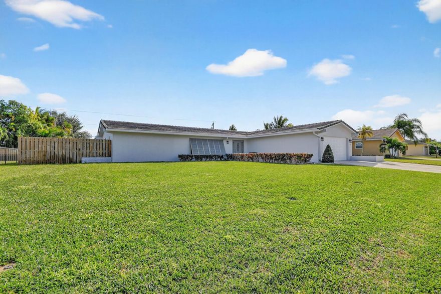 Welcome to 3094 Merion Terrace, Lake Worth, FL 33467 — where comfort, style, and Florida living meet! This beautifully maintained 4-bed 2-bath home offers a desirable split floor plan, spacious living areas, and an inviting screened-in patio with an oversized pool. The upgraded kitchen features granite countertops, modern cabinetry, and stainless-steel appliances, while both bathrooms have been tastefully updated for today’s lifestyle. Highlights include hurricane impact windows (2016), a tankless water heater (2021), A/C system (2025), variable speed pool pump, pool heater, and newer garage door motor (2022). Located in a peaceful, established neighborhood with no HOA, this home is close to shopping, dining, top-rated schools, major highways, and just a short drive to beautiful beaches.