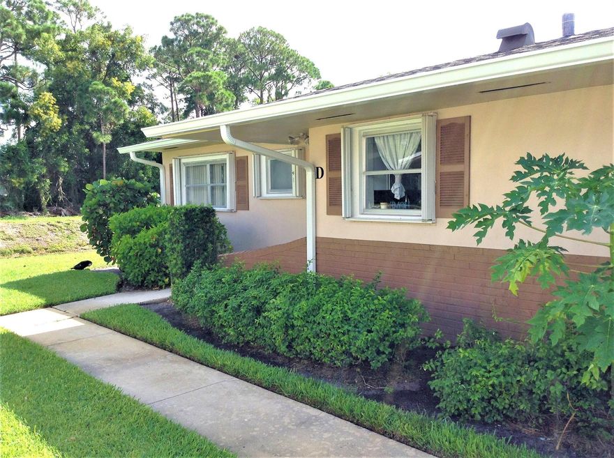 Beautifully renovated Villa. End/corner unit on the water. Eastern exposure makes this corner unit especially light and bright. Water view from bedrooms and living room. Open floor concept features White Shaker Cabinets with soft close drawers, Black Stainless Steel appliances and Sparkly White Quartz Counter tops. Crown molding, LED recessed lighting, water & ice in refrigerator. Tile floors through out. Step down Walk in master bathroom shower. Walk in shower in guest bathroom. More closets then imaginable. 5 large closets inside and large storage closet off enclosed porch. A/C 2016. New roofs installed 2020. Low monthly maintenance includes cable, water, garbage/sewer and onsite laundry with dedicated laundry time per unit. Income of $30,000 and credit score of 693 required.