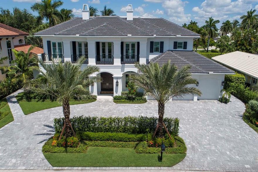 A circular drive, rimmed with podocarpus hedges, dotted with specimen palms, is prelude to an up-lit mature tropical landscape, hedged and gated for privacy. An expansive entertaining loggia with staggered marble floor, built-in TV and fireplace overlooks a sun-splashed heated saltwater pool and spa. The first floor master suite covered patio and expansive balconies along four upstairs guest suites offer additional opportunities for relaxation. Royal Palm Yacht and Country Club membership is separate and not affiliated with RPIA homeownership.