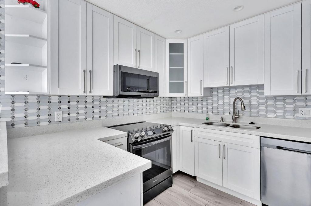 Photo of 810 Lake Shore Drive #44, Lake Park, FL 33403 (MLS # R11145640)