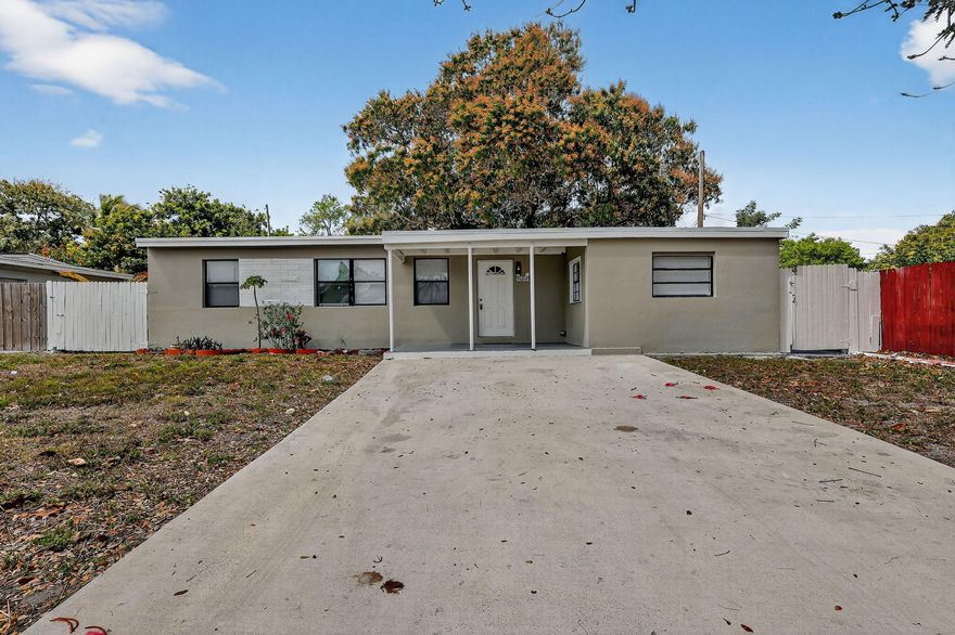 Four-bedroom, two-bathroom CBS construction home located in the Lake Forest neighborhood of West Park. Conveniently situated between the Florida Turnpike and I-95 and just minutes from Hallandale Beach, shopping, and dining. This well-maintained property features a new flat deck roof, new AC, and an updated kitchen with granite countertops and stainless steel appliances. The home offers a desirable split floor plan and two nicely appointed bathrooms with modern tile showers. Enjoy a massive backyard with plenty of room for a pool, outdoor entertaining, or future expansion. The large driveway provides ample parking for four or more vehicles, making this home both practical and versatile for homeowners or investors alike.