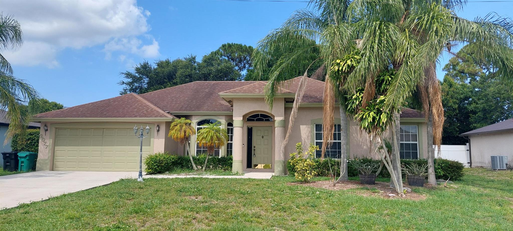 Spacious 3 bed, 2 bath with a den. 2 car garage. Open floor plan with large great room with laminate flooring and attractive bowed front windows. Nice built-ins. Master bathroom with double sinks. Refrigerator and dishwasher just about two years new. Air conditioner replaced in 2023. Covered and screened lanai backs up to utility right of way for privacy. Hurricane panels all around. This home is located just minutes from the new and popular Tradition area of Port St Lucie featuring upscale restaurants, entertainment, sports, and more without the additional Tradition taxes. Close to route 95 for easy access to Orlando, West Palm Beach and south. ASK ABOUT OUR FINANCIAL INCENTIVES !