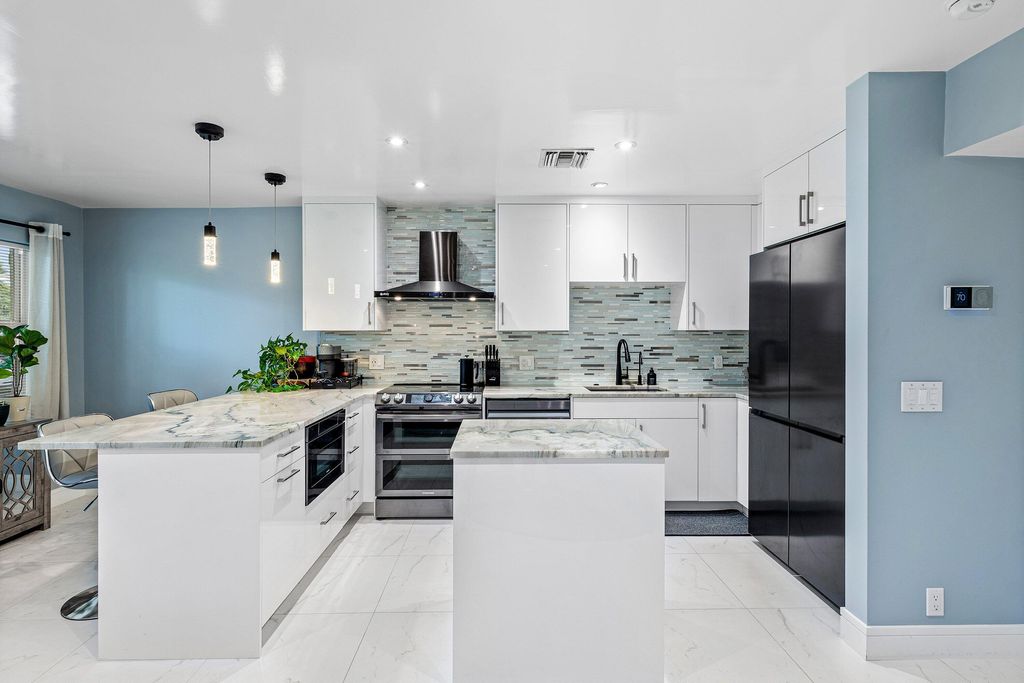 Photo of 100 Bravado Lane #2, Palm Beach Shores, FL 33404 (MLS # R11163658)