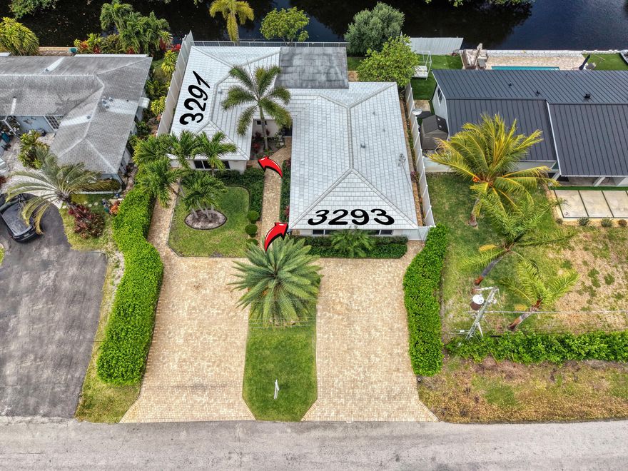 This rare waterfront duplex features two separate units, each with 2 bedrooms and 2 bathrooms, all in impeccable condition. Both units were completely renovated by the owner, including the driveway. The roof is only 6 years old. Both units have central A/C, and all windows and doors are impact-rated. Offering lifestyle and investment potential, each unit boasts spacious interiors, natural light, and well-designed layouts. Enjoy canal views and a peaceful outdoor setting, minutes from the beach, shopping, and dining. A rare, versatile opportunity in a highly desirable area. All information is deemed reliable but not guaranteed and should be independently verified.