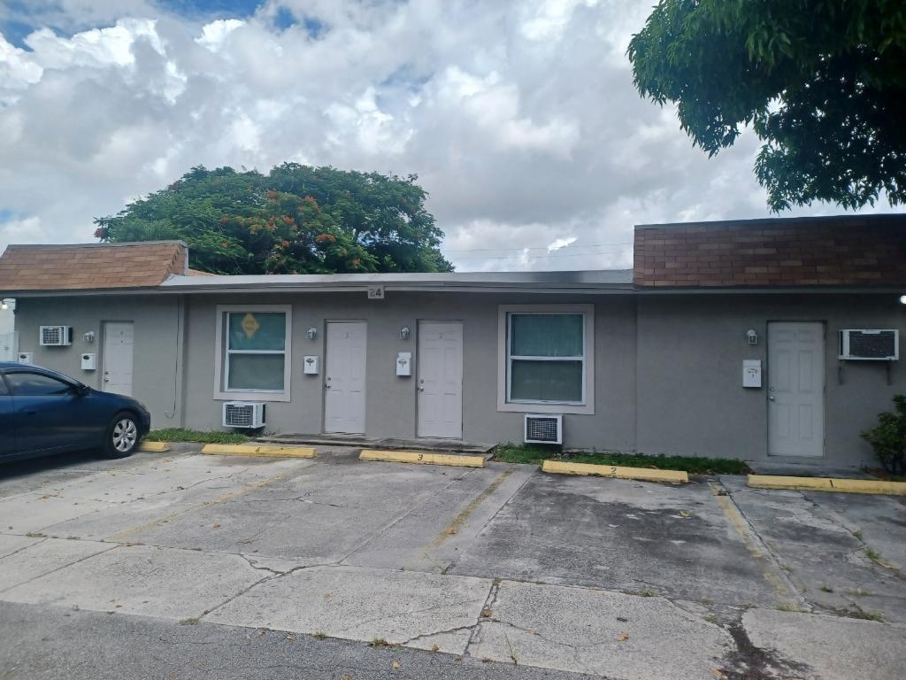 5 unit bldg. consisting of 1 large 1 bedroom 1 bath and 1 large studio ,2 large efficiencies and 1 small efficiency. This building has been totally renovated with a new Roof, new impact windows and doors, new stucco, new paint, new kitchens, new bathrooms, new tile throughout each unit, new PVC white fence, new electric with six meters one for each apartment and one house meter for common area lights and laundry also can be used as Airbnb city of Dania allows. $7,100 a month income.