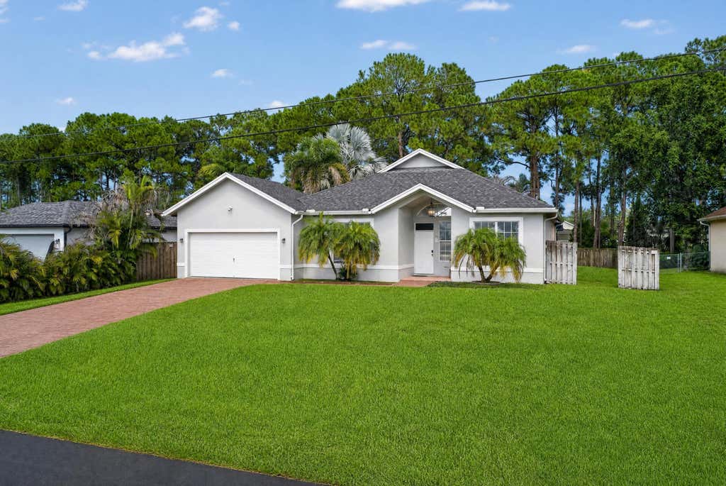 Photo of 4059 SW Kamsler Street, Port Saint Lucie, FL 34953 (MLS # B26063960)