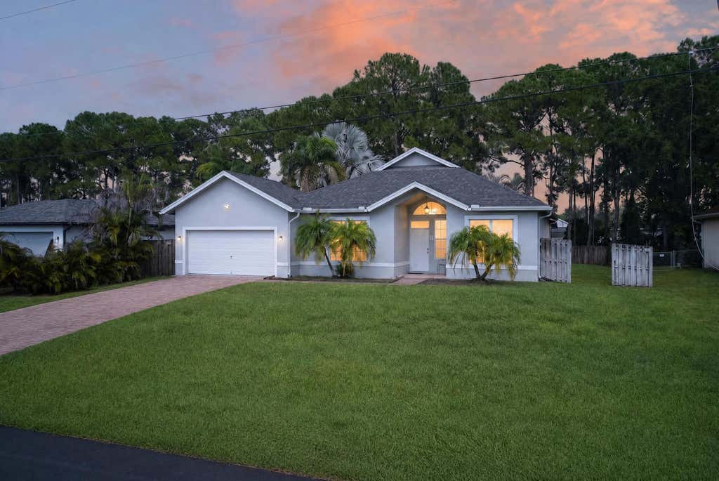 Photo of 4059 SW Kamsler Street, Port Saint Lucie, FL 34953 (MLS # B26063960)