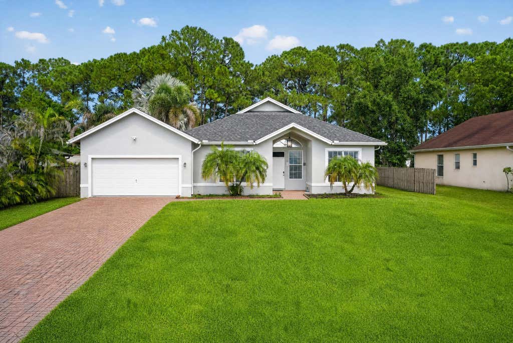 Photo of 4059 SW Kamsler Street, Port Saint Lucie, FL 34953 (MLS # B26063960)