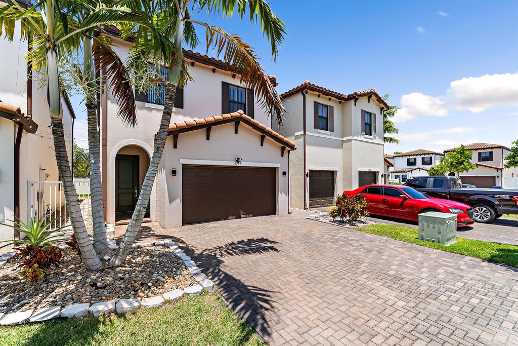 Photo of 6024 Pine Tree Way, Riviera Beach, FL 33410 (MLS # R11089040)