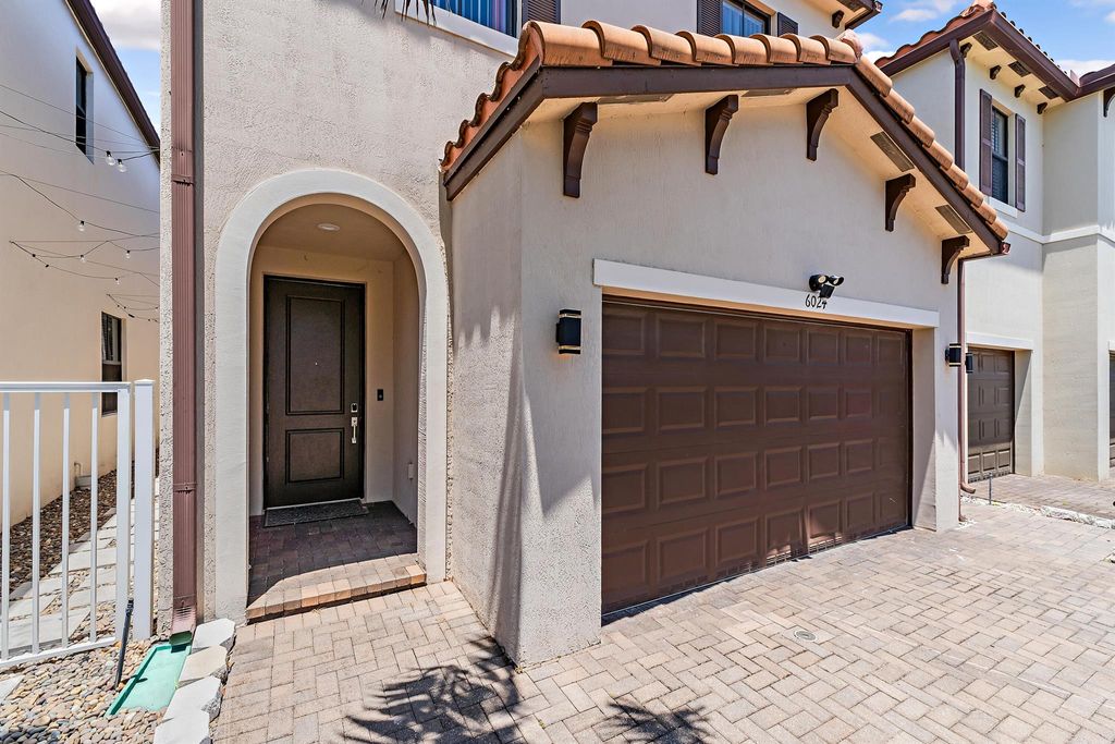 Photo of 6024 Pine Tree Way, Riviera Beach, FL 33410 (MLS # R11089040)