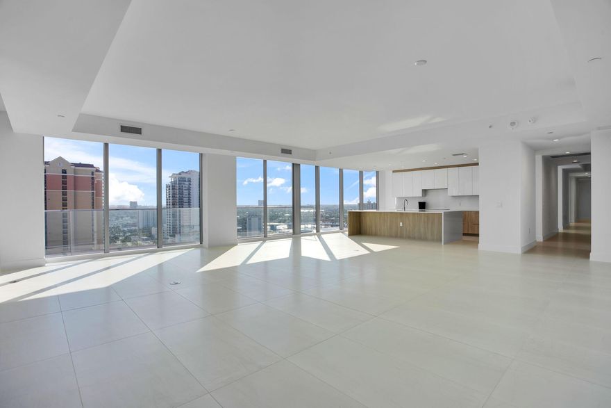 NOW COMPLETE - MOVE IN READY! Experience the ultimate oceanfront lifestyle in this spacious flow-through Tiffany residence available for lease. Offering 3 bedrooms, 4 full baths, & a den, this home showcases sweeping ocean, Intracoastal, and skyline views. Floor-to-ceiling glass and expansive wraparound terraces create seamless indoor-outdoor living. The residence features a modern design, a generous primary suite with a spa-inspired bath and private terrace, along with well-appointed guest suites ideal for full-time or seasonal living. Two valet parking stickers are included. Enjoy resort-style amenities, including direct beach access, pool, fitness and motion studios, theater, and game simulator. Perfectly located just south of A1A and just steps from Las Olas Marina and Las Olas Blvd.