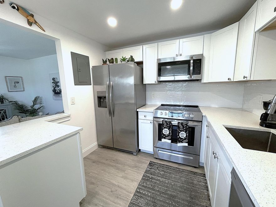 Escape to your private paradise in this beautifully renovated condo in the desirable Kings Point community. With sleek, modern finishes and an open, airy layout, this corner unit is the perfect retreat. Enjoy cooking in the gourmet chef's kitchen with quartz counters and stainless steel appliances. The kitchen opens to the living room for today's modern lifestyle. Extra powder room for your guests. Romantic master suite with a private bathroom offers ample space to unwind. Savor cool breezes on your four season screened-in balcony, perfect for your morning cup of coffee or reading a book. This guard gated community offers resort style amenities, and a vast array of clubs, classes and social events - the pinnacle of vibrant adult living! Elevator. Minutes to shopping, dining & beaches.