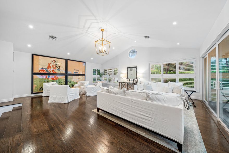 An extraordinary oceanfront opportunity awaits in the coveted seaside enclave of Ocean Ridge—one of Palm Beach County's last charming coastal villages, just minutes from Worth Avenue and Atlantic Avenue. This fully updated estate pool home offers over 5,200 sq ft on an oversized corner lot with direct ocean frontage. Highlights include a contemporary kitchen with Sub-Zero appliances and a generous central island, a dramatic elevated living room with soaring ceilings and ocean views, and two guest suites on the main level. The expansive upstairs primary suite features unobstructed ocean vistas, sitting area, office/den, dual baths, and dual walk-in closets. A 45-foot lap pool is privately set within lush tropical gardens, creating a serene coastal retreat.