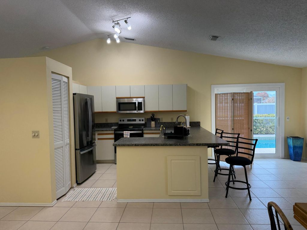 Photo of 404 NE Camelot Drive, Port Saint Lucie, FL 34983 (MLS # R11162914)