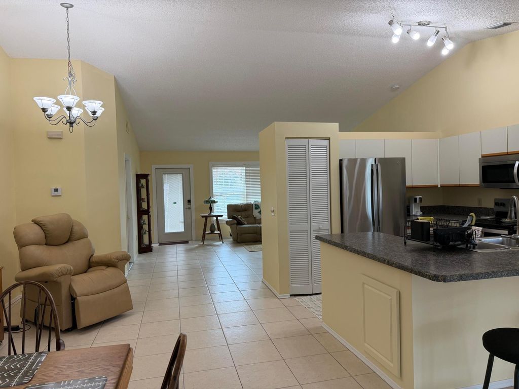 Photo of 404 NE Camelot Drive, Port Saint Lucie, FL 34983 (MLS # R11162914)
