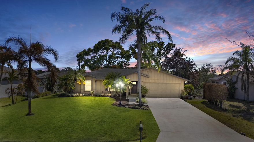 Lovingly maintained and truly move-in ready, this home in the heart of Port St Lucie showcases exceptional curb appeal and clear pride of ownership. With key updates already completed (roof 2025, A/C, windows, in 2024-25, and kitchen in 2022), this home delivers comfort, peace of mind, and budget-friendly living. From the large, tiled, screened patio, step into a tranquil, fully fenced backyard oasis with lush landscaping that has weathered the recent freeze beautifully--how many Staghorn ferns can you find? An additional storage shed offers extra room for tools, hobbies, or seasonal décor.  Whether relaxing outdoors or entertaining guests, everything is in place for easy Florida living. Garage refrigerator and generator included! See the floor plan and features sheet for details!