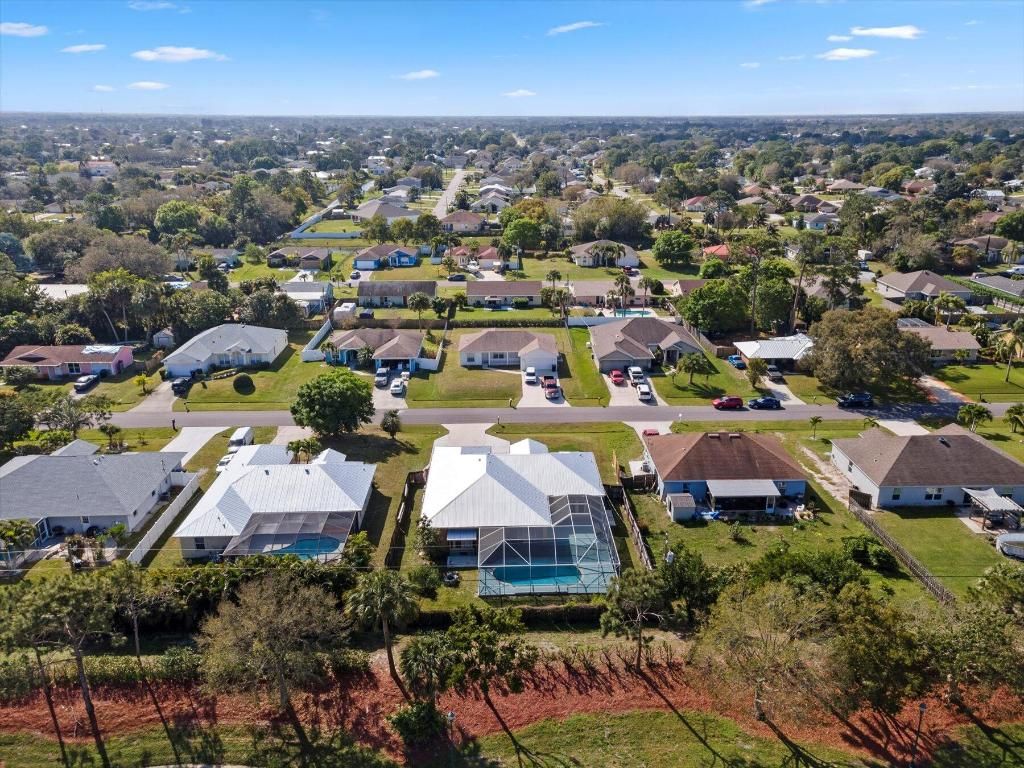 Photo of 1225 SW Janette Avenue, Port Saint Lucie, FL 34953 (MLS # R10960088)