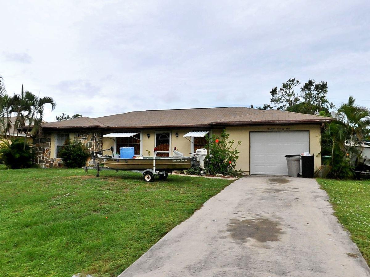 Home is located in nice and quiet neighborhood, Floor tile throughout. Open Kitchen, Large Backyard