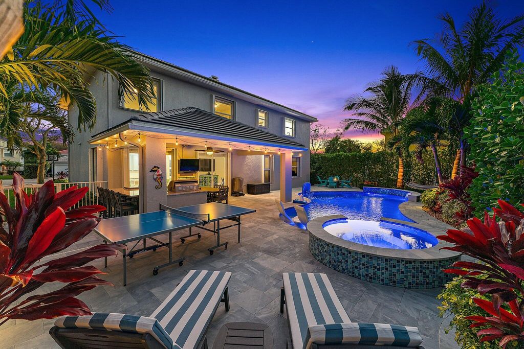 Photo of 573 E Cocoplum Drive E, Jupiter, FL 33458 (MLS # R10961953)