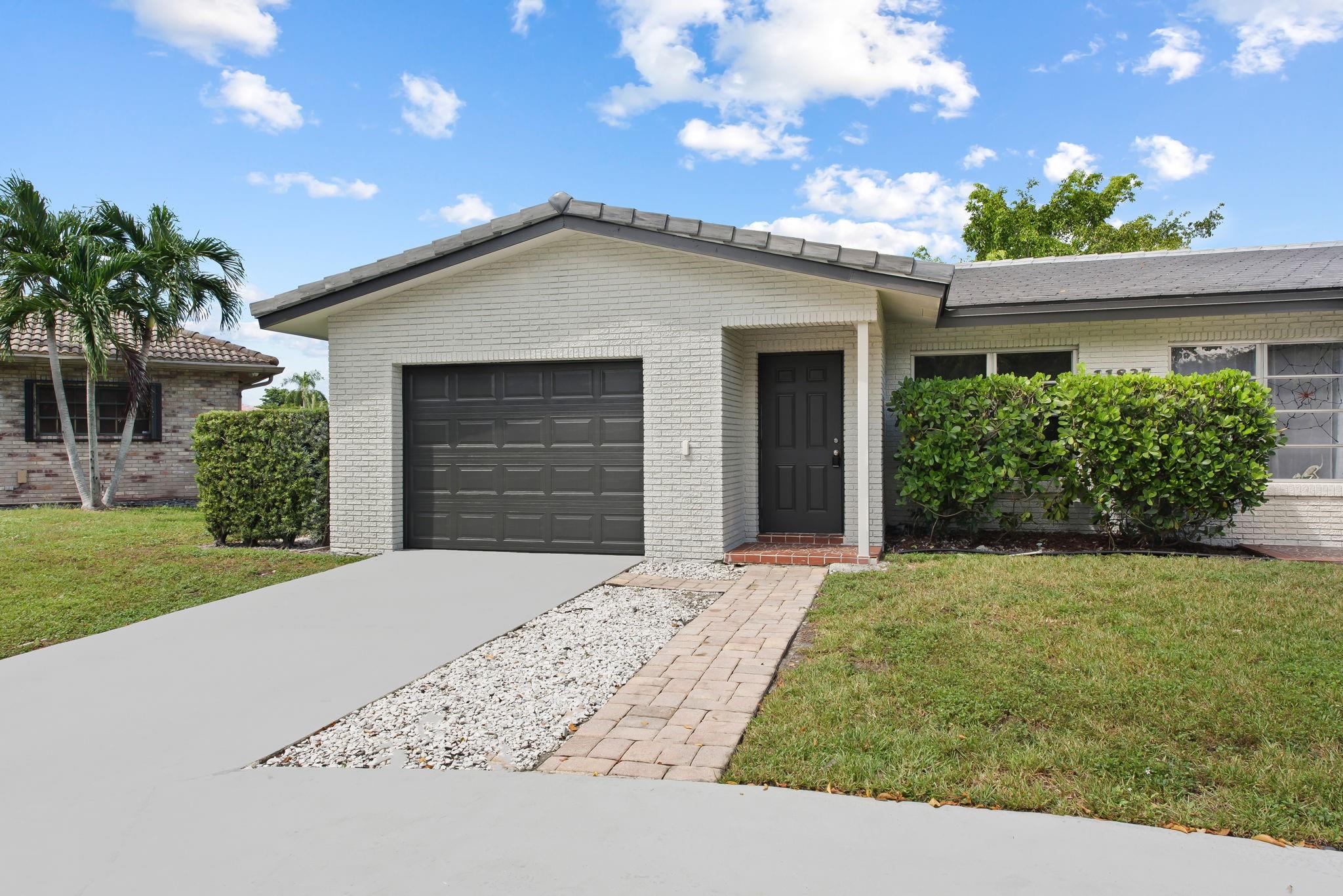 Spacious 2 Bed 2 Bath Home With 1 Car Garage In Coral Springs Located On A Cul-De-Sac. Featuring Updated Kitchen With Stainless Steel Appliances, Screened-In Patio, Oversized Laundry/Utility Room With Extra Storage, Wood Laminate Flooring Throughout, Plenty Parking With Private Driveways And Much More! Centrally Located In West Coral Springs And Available For Immediate Occupancy. No HOA Approval Required.