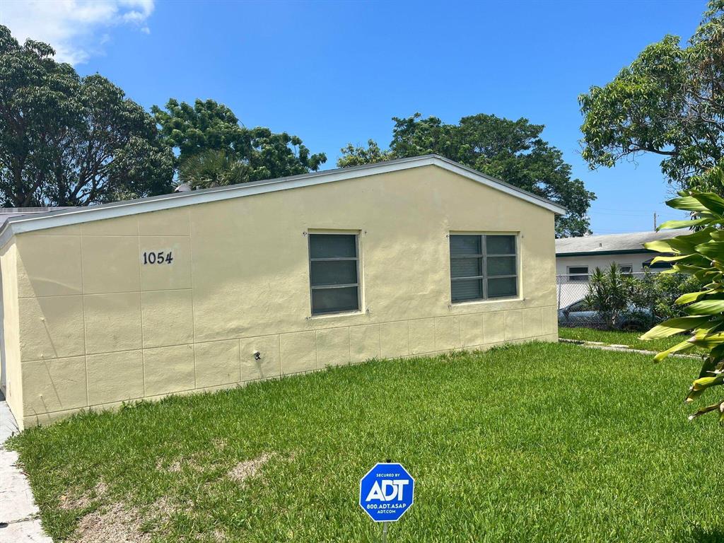 Cute home 4/2 home, with 3/1 in the main section of the home, along with a small living room, bedroom, private bath and laundry hookup that could be used as a mother in law on the other side of the kitchen. Beautiful large front and back yard for your enjoyment. Big mango tree in the back that produces amazing fruit. Plenty of parking. Landlord tends to the yard and pest control.