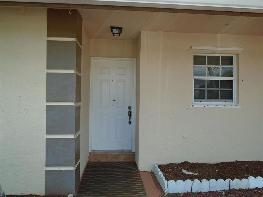 Centrally located villa, features all tile floors, CBS construction, central air and heat. Nice porch overlooking pond. Walk-in closet, 2 full bathrooms, laundry room with washer and dryer. Hurricane shutters, and ceiling fans. 
New A/C 2020. New kitchen cabinets.

All figures are approximate.