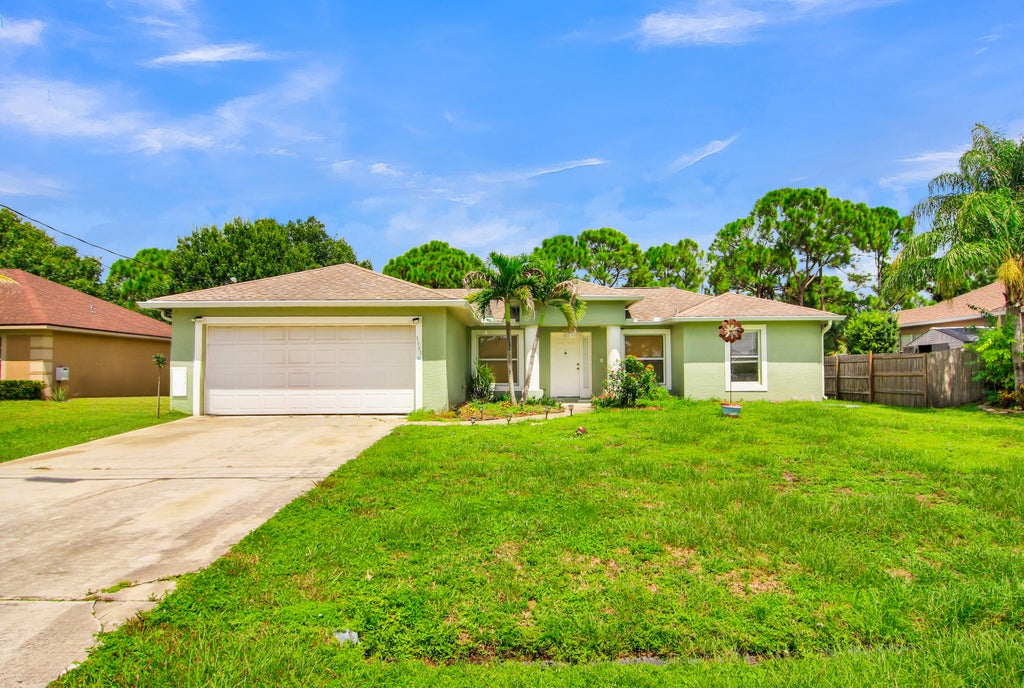 Photo of 1931 SW FEARS Avenue, Port Saint Lucie, FL 34953 (MLS # B26073913)