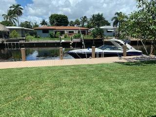Bring your boat or water toys! Beautiful modern updated waterfront ocean access 3 bedroom, 3 full bath home with a garage! Living Room, separate large family room and formal dining room. Park your boat in your backyard on your private 65 ft dock with water and electricity. New addition with vaulted ceilings. New modern white kitchen with huge Quartzite island. Plenty of storage! Travertine marble throughout. Entire house has Storm windows and doors. Open floor plan. Newer roof, AC, stainless appliances, and window treatments. Save on your electric bill with Gas range, dryer and tankless water heater. Automatic garage door opener. Includes lawn maintenance. No Inside Smokers please. No HOA so trucks OK. Landlord pays lawn maintenance.