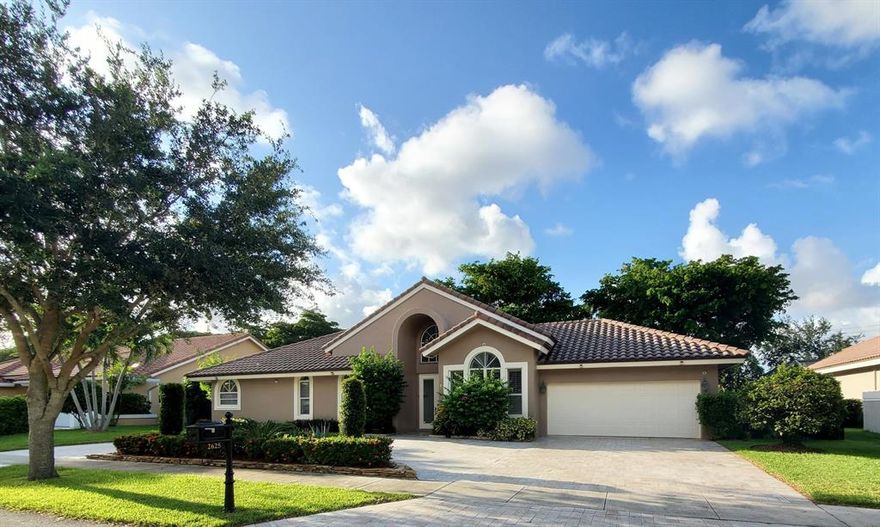 Gorgeous MOVE in ready home in desirable New Floresta close to top rated public and private schools. This magnificent 5 bedroom, 3 full bath home is light and bright with formal dining room and living room, spacious family room with pool and garden views. Large master bedroom with pool views, wood floors.  NO CARPET!. Split bedroom plan. Laundry room with full size washer and dryer, laundry tub and storage.  Incredible location close to everything in the heart of Boca Raton.  Call for immediate showing.