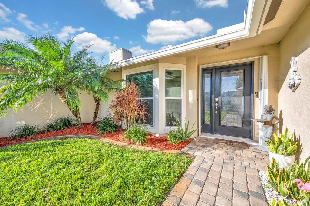 Photo of 665 NE Vanda Terrado, Jensen Beach, FL 34957 (MLS # R10943010)