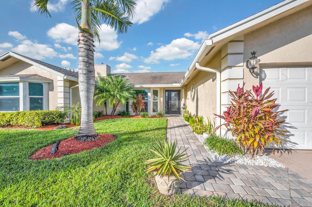 Photo of 665 NE Vanda Terrado, Jensen Beach, FL 34957 (MLS # R10943010)
