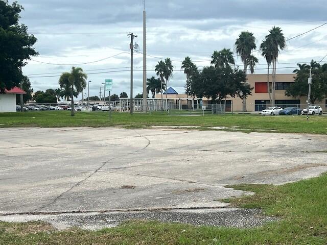 Prime 0.45-Acre Property in the Heart of Downtown Pahokee - Endless Commercial Possibilities. Located in the heart of downtown Pahokee, this 0.45-acre vacant lot offers unmatched potential for a wide range of commercial developments. Its strategic location near shopping centers, gas stations, and key businesses ensures high visibility and accessibility, making it an ideal site for entrepreneurs and investors. Zoned for commercial core, residential, office, and entertainment uses, the property provides flexibility for various ventures including retail spaces, office buildings, mixed-use developments, or entertainment venues. Whether you're looking to create a bustling business hub or a vibrant community center, this property offers endless possibilities for growth and success.