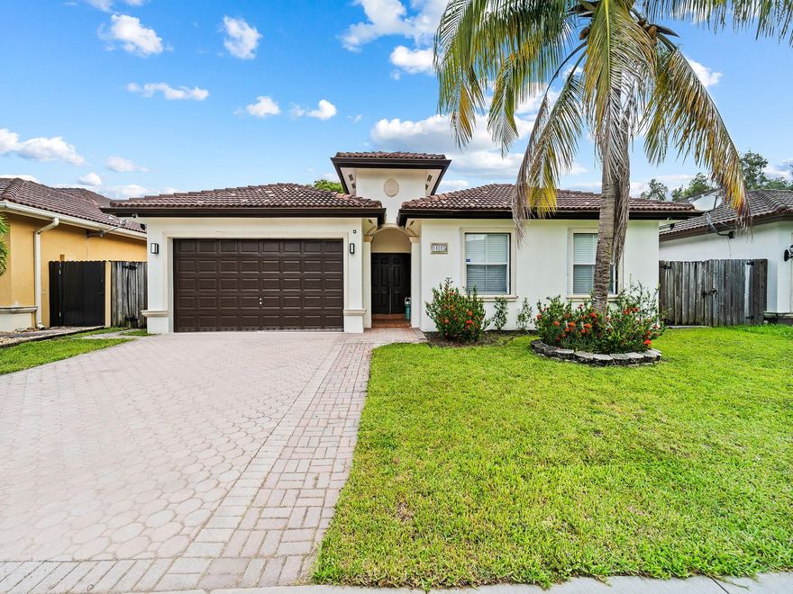 This stunning 4-bed, 2.5-bath home in West Miami is move-in ready and located in a top-rated school district. Featuring all-new updates, a spacious open layout, vaulted ceilings, LED recessed lighting, and LVP waterproof flooring. The main living area includes a formal living/dining combo, a family room, and a kitchen with Quartz counters, eat-in space, and rear patio access. The master suite offers a spa-like bath with marble-inspired tile, Quartz counters, vessel sinks, a stand-up shower, and soaking tub. Extras include solar panels, crown molding, fresh paint inside/out, premium baseboards, new lighting and fans, walk-in closets, a paver driveway, plus 2022 AC and water heater. Don’t miss this incredible home!