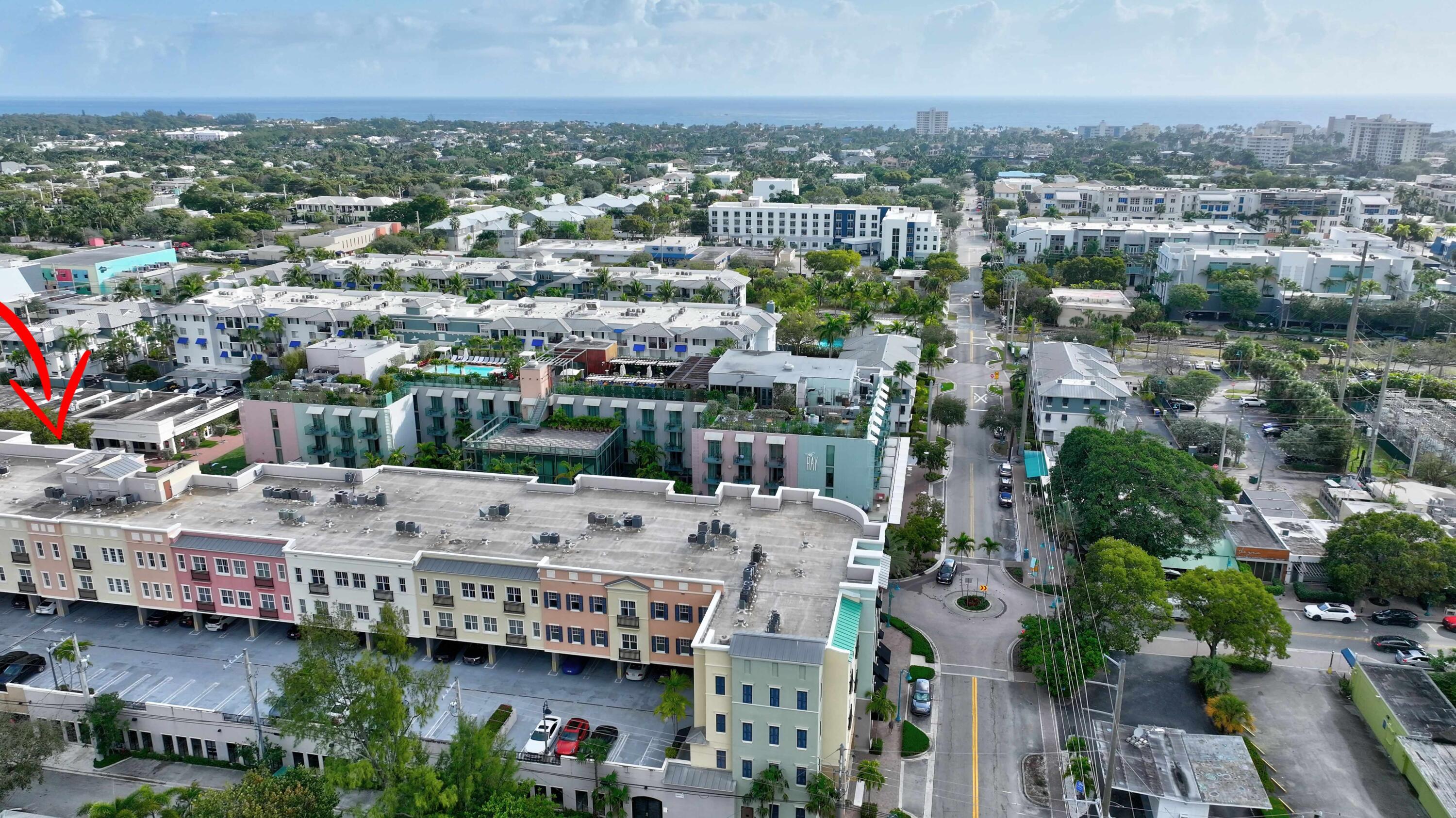 Discover an exceptional living opportunity in the heart of Pineapple Grove with this chic 3-bedroom, 2-bath condo. This oversized corner unit boasts east-facing views, bathing the interior in natural sunlight. Its versatile den/office can easily be used as a third bedroom, offering flexibility to suit your needs. Location is everything, and this condo delivers. You'll be minutes from fine shops, pristine beaches, and directly across from The Ray, a new hotel offering exclusive access to world-class amenities with a day pass. The residence itself offers a perfect blend of style and comfort, featuring elegant neutral colors, upscale furniture, and modern lighting. The beautiful Kitchen includes a granite counter with stainless steel appliances and a breakfast bar. *6 month lease possible.